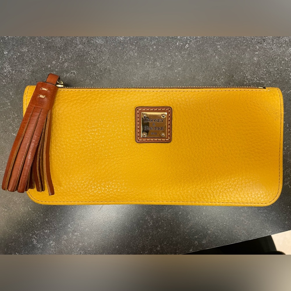Dooney & Bourke mustard yellow wallet. Like new condition.